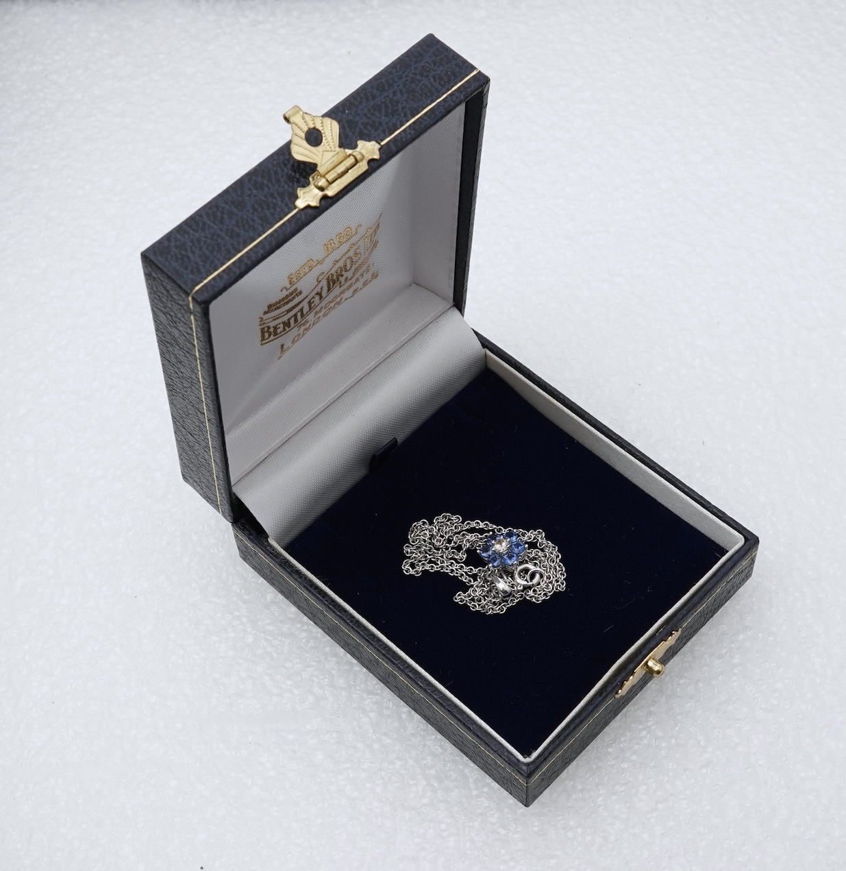 A sapphire and diamond pendant